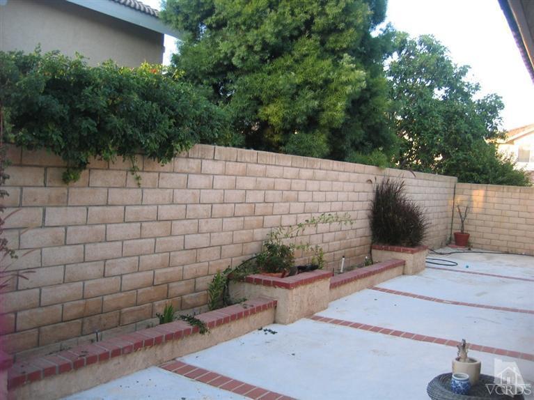 65 Valley Crest Road, Unit 74 Simi Valley, CA 93065 - Photo 21 of 25 a backyard of a house with lots of green space
