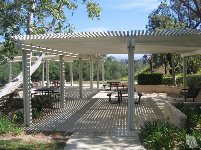 65 Valley Crest Road, Unit 74 Simi Valley, CA 93065 - Photo 23 of 25 a patio with table and chairs