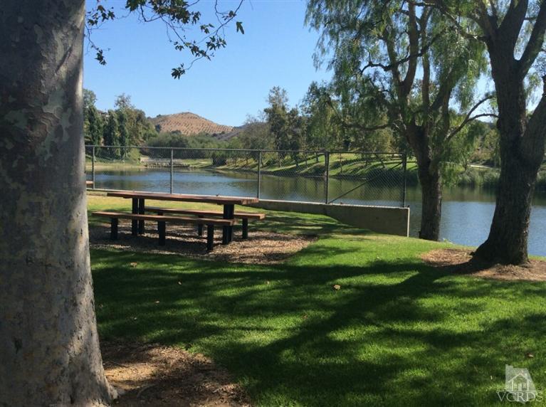 65 Valley Crest Road, Unit 74 Simi Valley, CA 93065 - Photo 24 of 25 a view of a lake with a yard