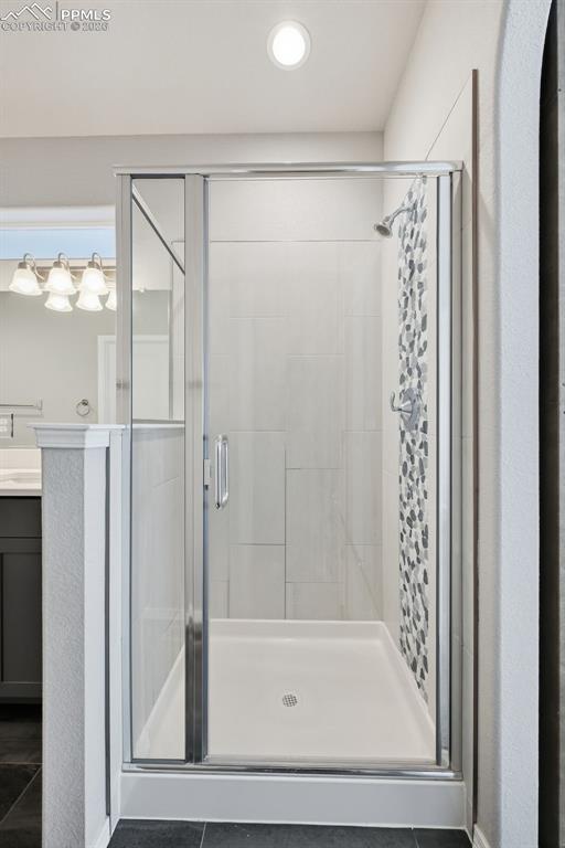 9962 Hidden Ranch Court Peyton, CO 80831 - Photo 18 of 48 a bathroom with a shower and a sink