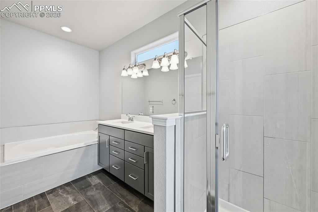 9962 Hidden Ranch Court Peyton, CO 80831 - Photo 19 of 48 a bathroom with a sink a vanity and a mirror