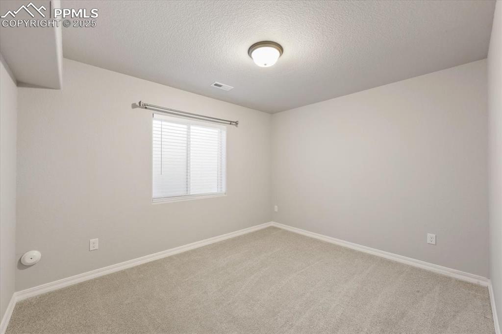 9962 Hidden Ranch Court Peyton, CO 80831 - Photo 24 of 48 an empty room with a window