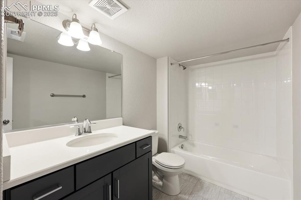 9962 Hidden Ranch Court Peyton, CO 80831 - Photo 25 of 48 a bathroom with a sink a toilet a mirror and shower