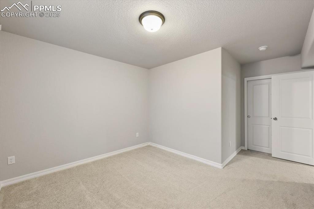 9962 Hidden Ranch Court Peyton, CO 80831 - Photo 26 of 48 an empty room with a empty space and window