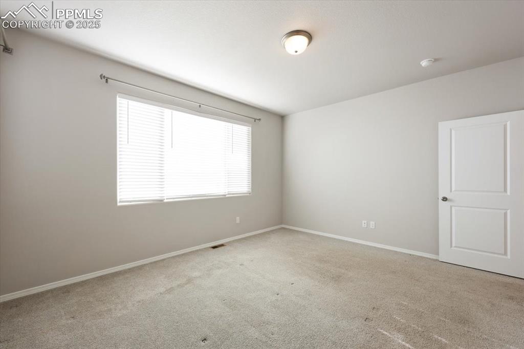 9962 Hidden Ranch Court Peyton, CO 80831 - Photo 27 of 48 an empty room with a window