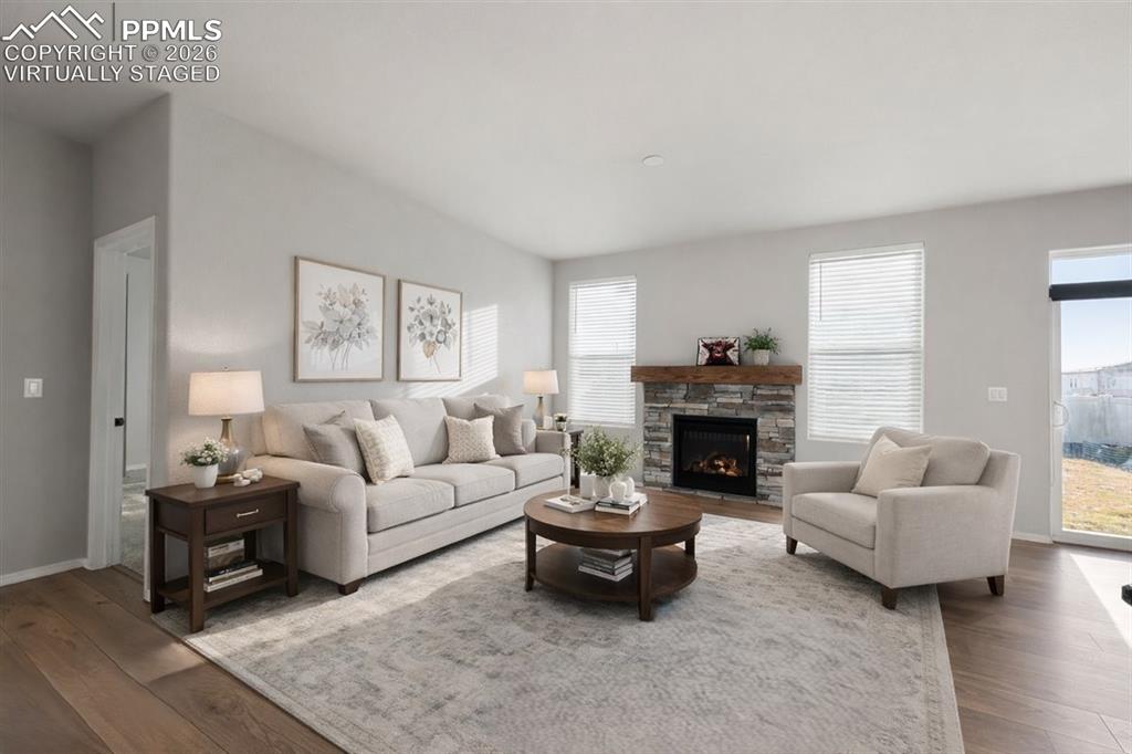 9962 Hidden Ranch Court Peyton, CO 80831 - Photo 3 of 48 a living room with furniture and a fireplace
