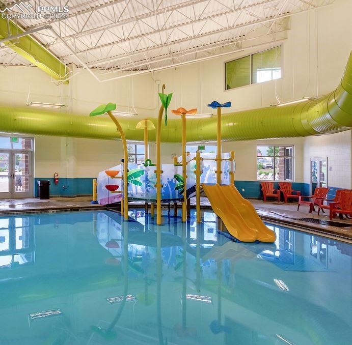 9962 Hidden Ranch Court Peyton, CO 80831 - Photo 45 of 48 a view of a swimming pool with sitting area