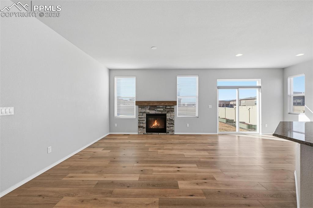 9962 Hidden Ranch Court Peyton, CO 80831 - Photo 6 of 48 a view of an empty room with window and fire place