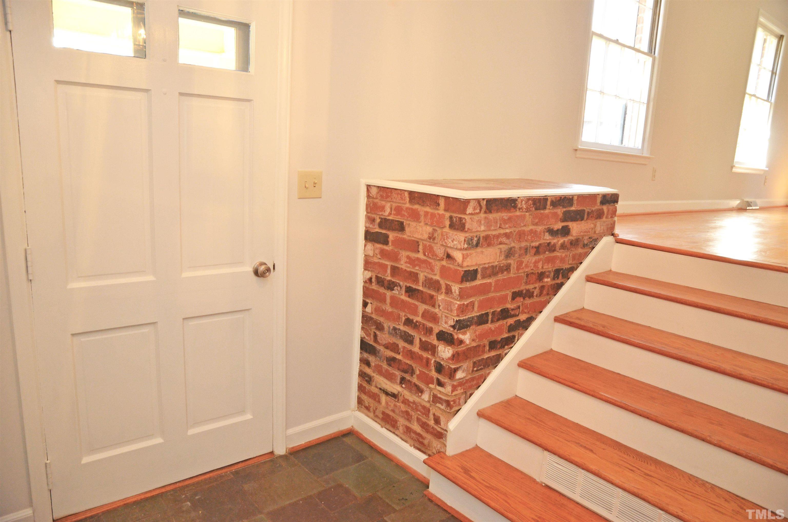 4112 Amherst Lane Raleigh, NC 27609 - Photo 3 of 28 a view of entryway with wooden floor and cabinet