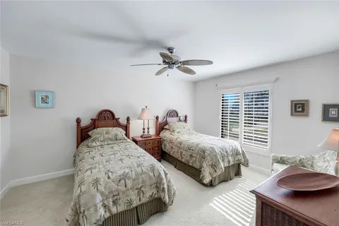 a bedroom with bed and a window