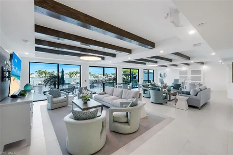 a view of living room with furniture and a potted plant