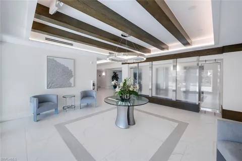 a view of a dining room with furniture and a window