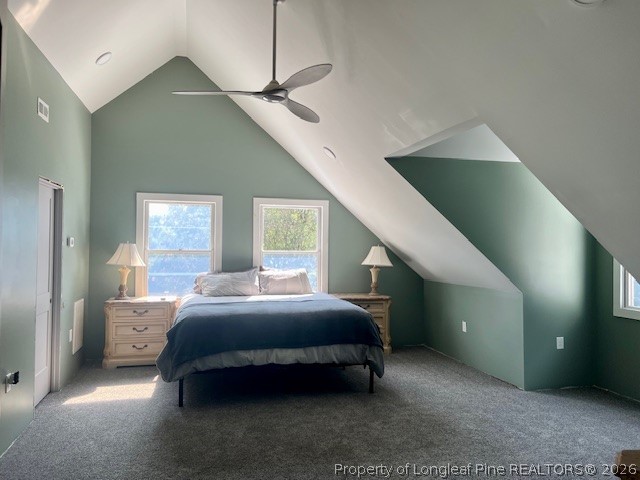 4119 Minnie Hall Road Autryville, NC 28318 - Photo 11 of 16 a bedroom with a bed and a chandelier