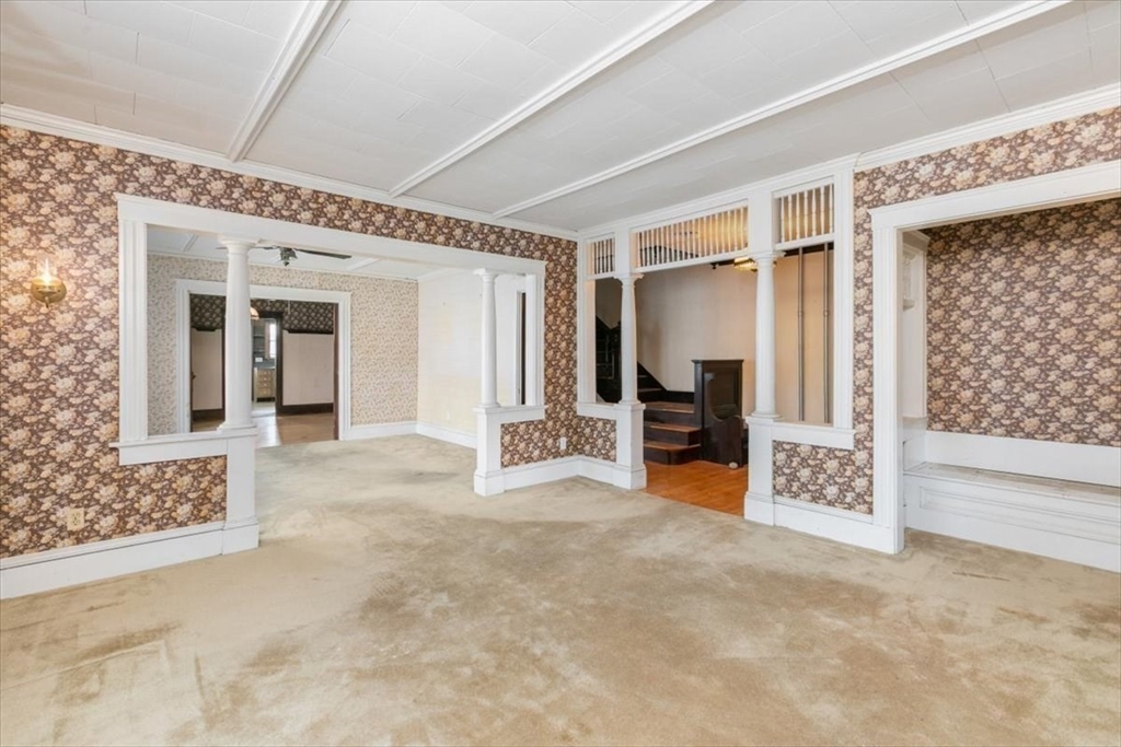98 Webster Street Haverhill, MA 01830 - Photo 8 of 42 a view of a hallway with wooden floor and a living room