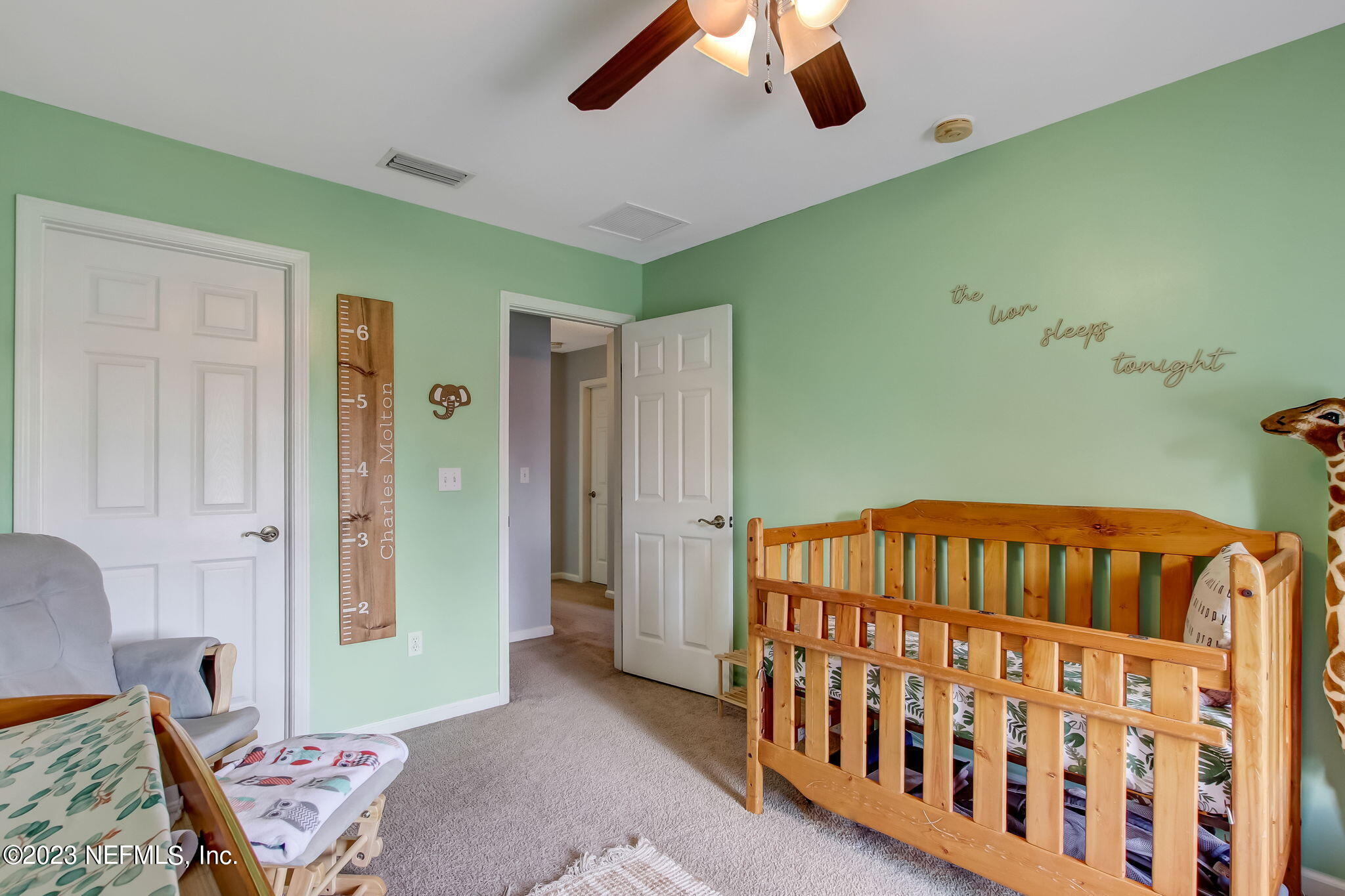 96054 Ridgewood Circle Fernandina Beach, FL 32034 - Photo 23 of 32 a bedroom with furniture and a window