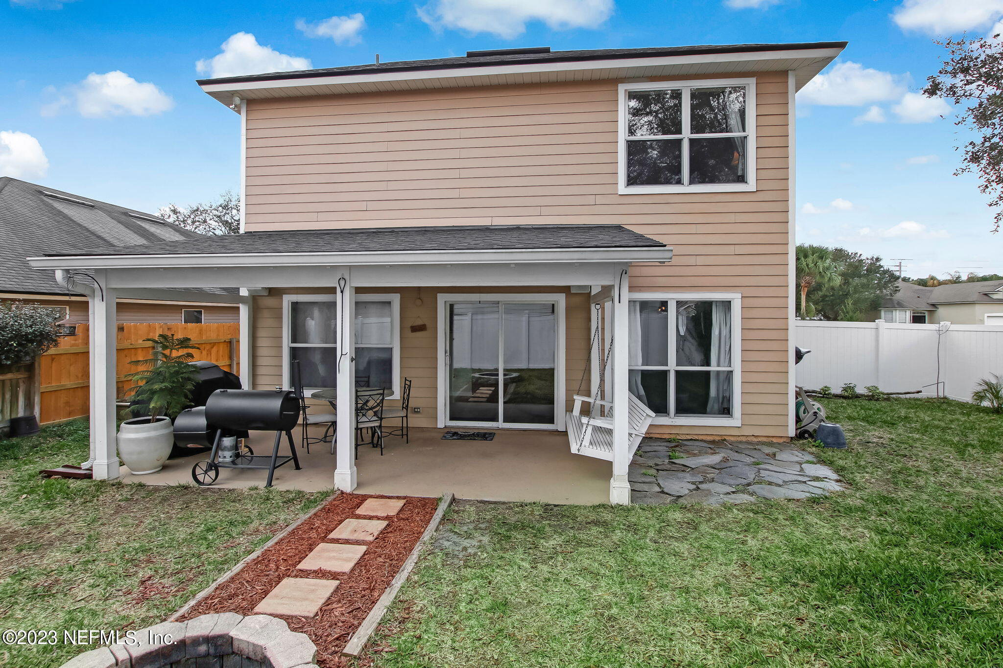 96054 Ridgewood Circle Fernandina Beach, FL 32034 - Photo 24 of 32 a front view of a house with garden