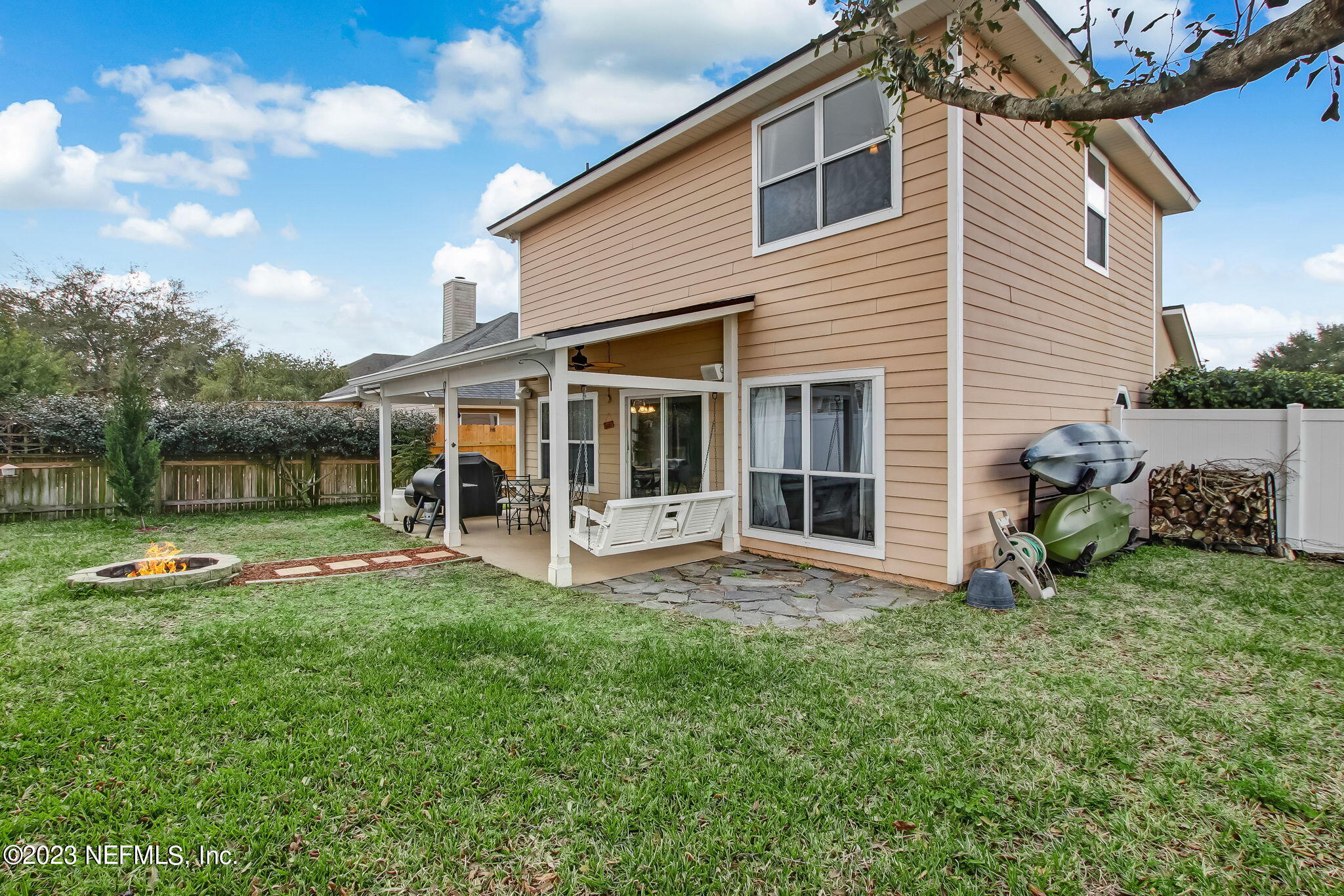 96054 Ridgewood Circle Fernandina Beach, FL 32034 - Photo 25 of 32 a front view of a house with a yard