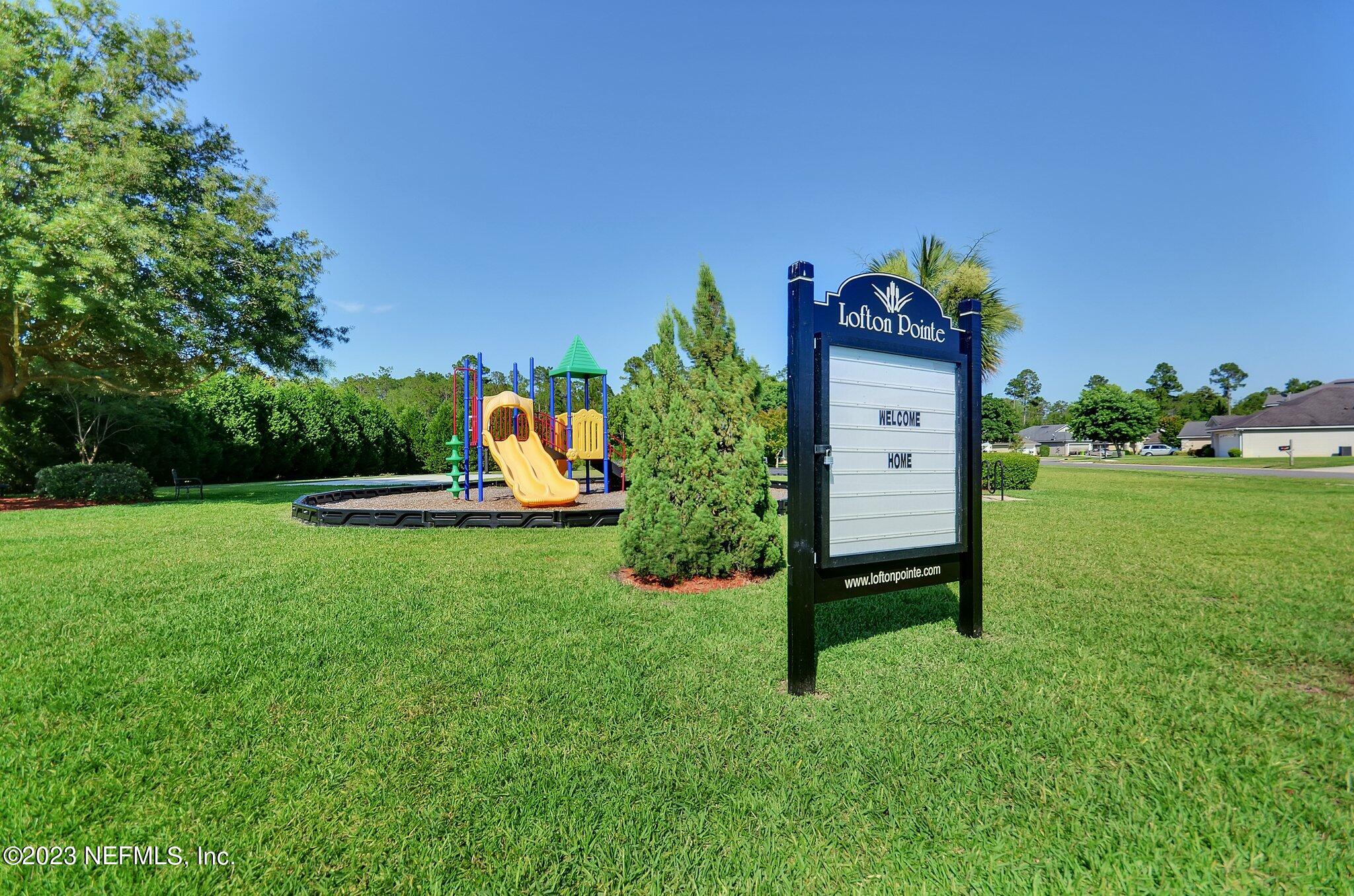 96054 Ridgewood Circle Fernandina Beach, FL 32034 - Photo 31 of 32 a view of a table and chairs in the garden