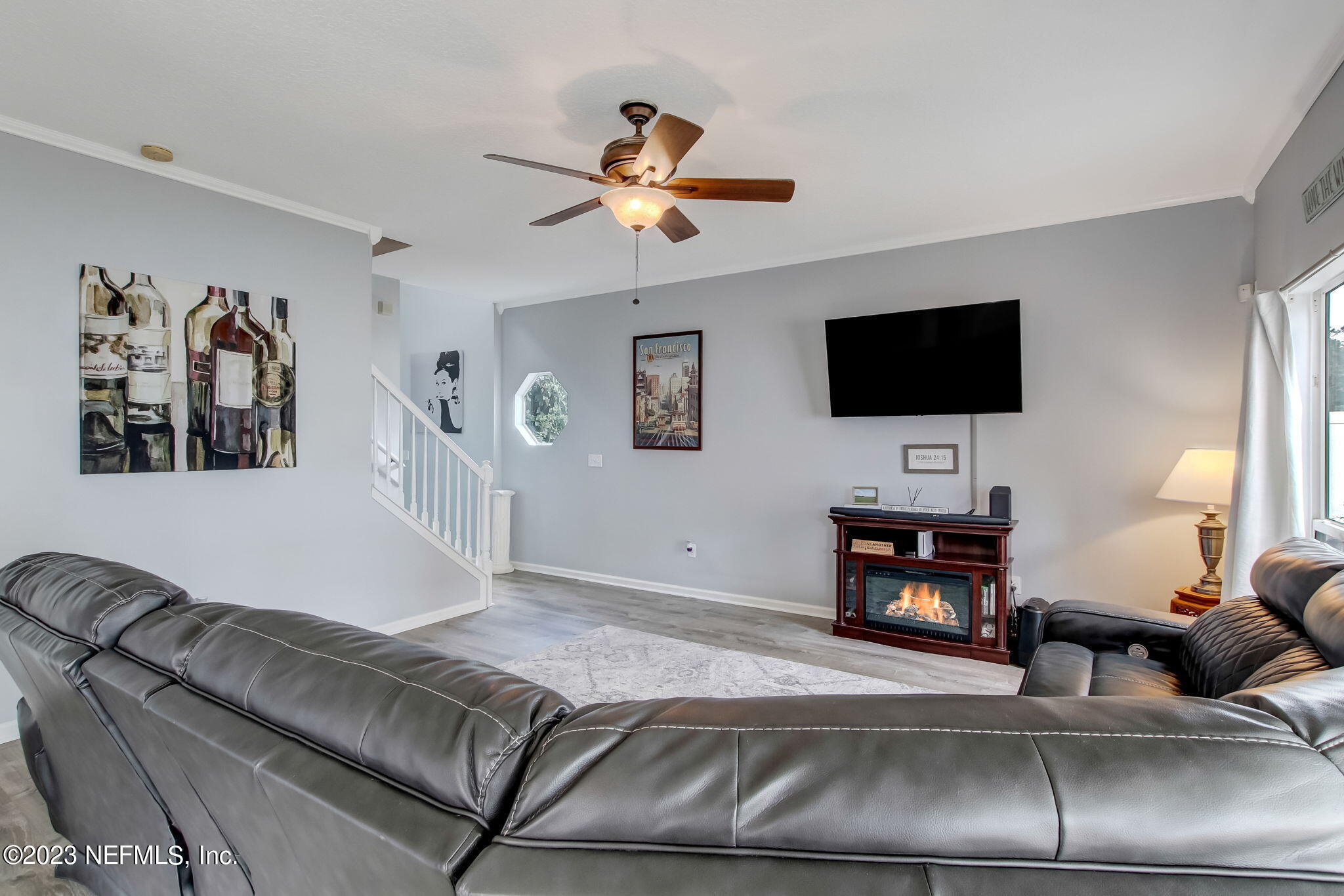 96054 Ridgewood Circle Fernandina Beach, FL 32034 - Photo 7 of 32 a living room with furniture and a flat screen tv