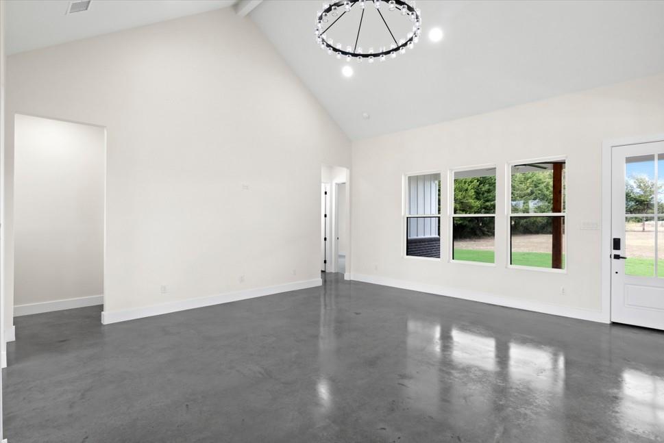 210 Wester Road Ferris, TX 75125 - Photo 15 of 25 a view of an empty room with a window and wooden floor