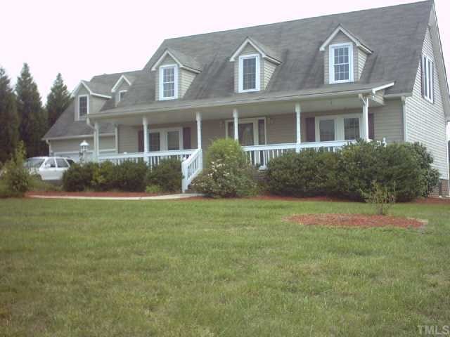 981 Robertson Road Roxboro, NC 27574 - Photo 1 of 7 a front view of a house with garden