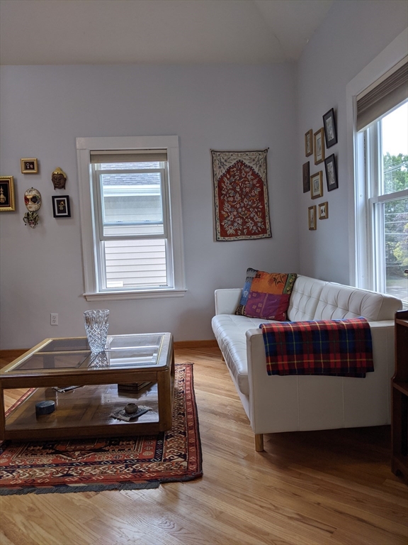 184 White Street, Unit 2 Belmont, MA 02478 - Photo 11 of 29 a living room with a bed furniture and a window