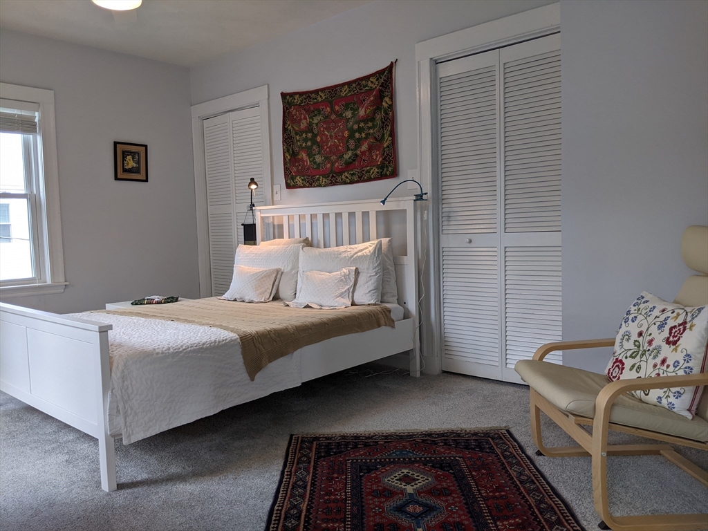 184 White Street, Unit 2 Belmont, MA 02478 - Photo 17 of 29 a bedroom with a bed and a window