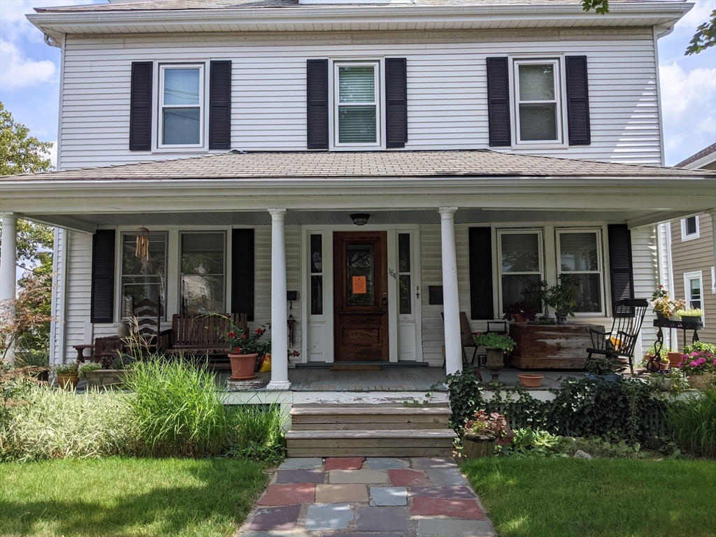 184 White Street, Unit 2 Belmont, MA 02478 - Photo 2 of 29 a house view with a garden space