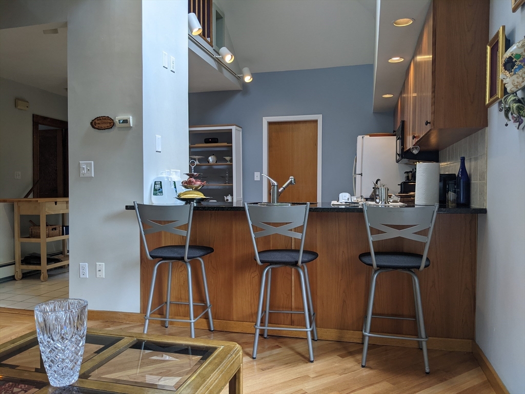 184 White Street, Unit 2 Belmont, MA 02478 - Photo 4 of 29 a dining room with furniture and wooden floor