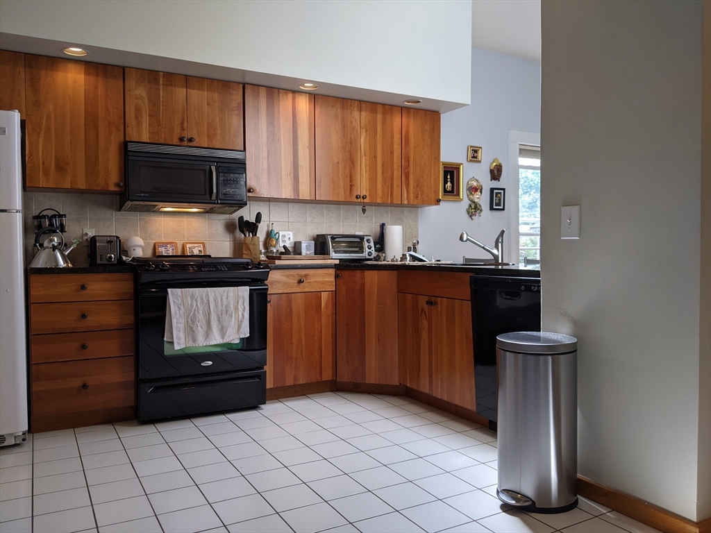 184 White Street, Unit 2 Belmont, MA 02478 - Photo 5 of 29 a kitchen with a sink a stove and cabinets