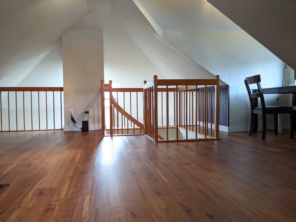 184 White Street, Unit 2 Belmont, MA 02478 - Photo 8 of 29 an empty room with wooden floor and windows