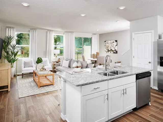 a living room with furniture and windows
