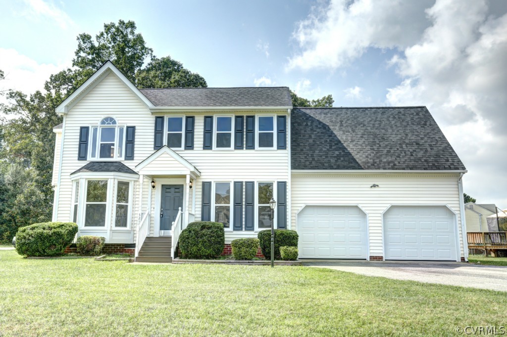 a front view of a house with a yard