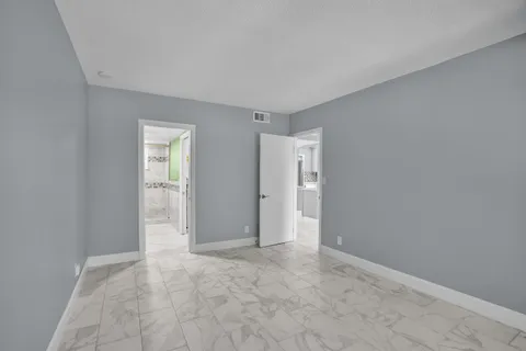 a bathroom with a sink mirror toilet and bathtub