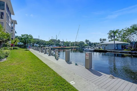 a view of a lake with a house in the background