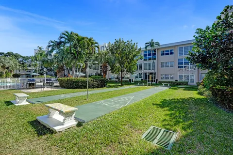 a view of a chairs and tables in the backyard