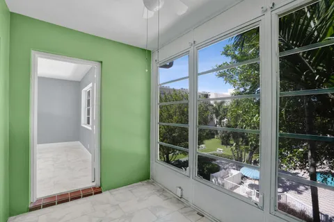 a view of room with window and ceiling fan