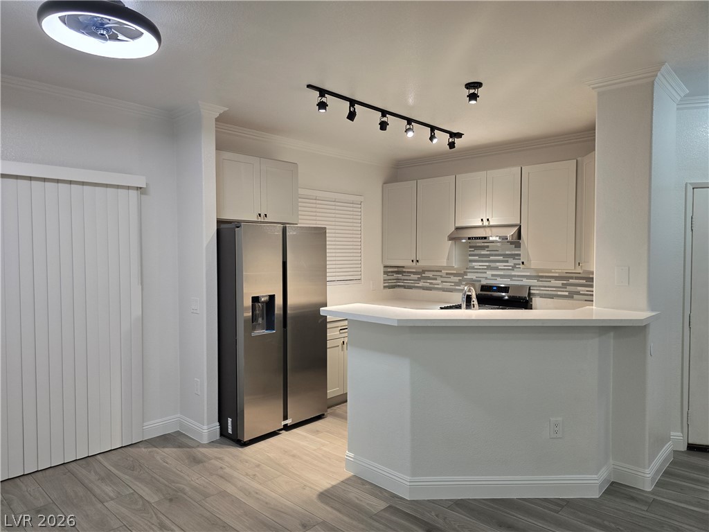 1881 West Alexander Road, Unit 1127 North Las Vegas, NV 89032 - Photo 5 of 20 A well-appointed kitchen features stainless steel appliances and wood flooring.