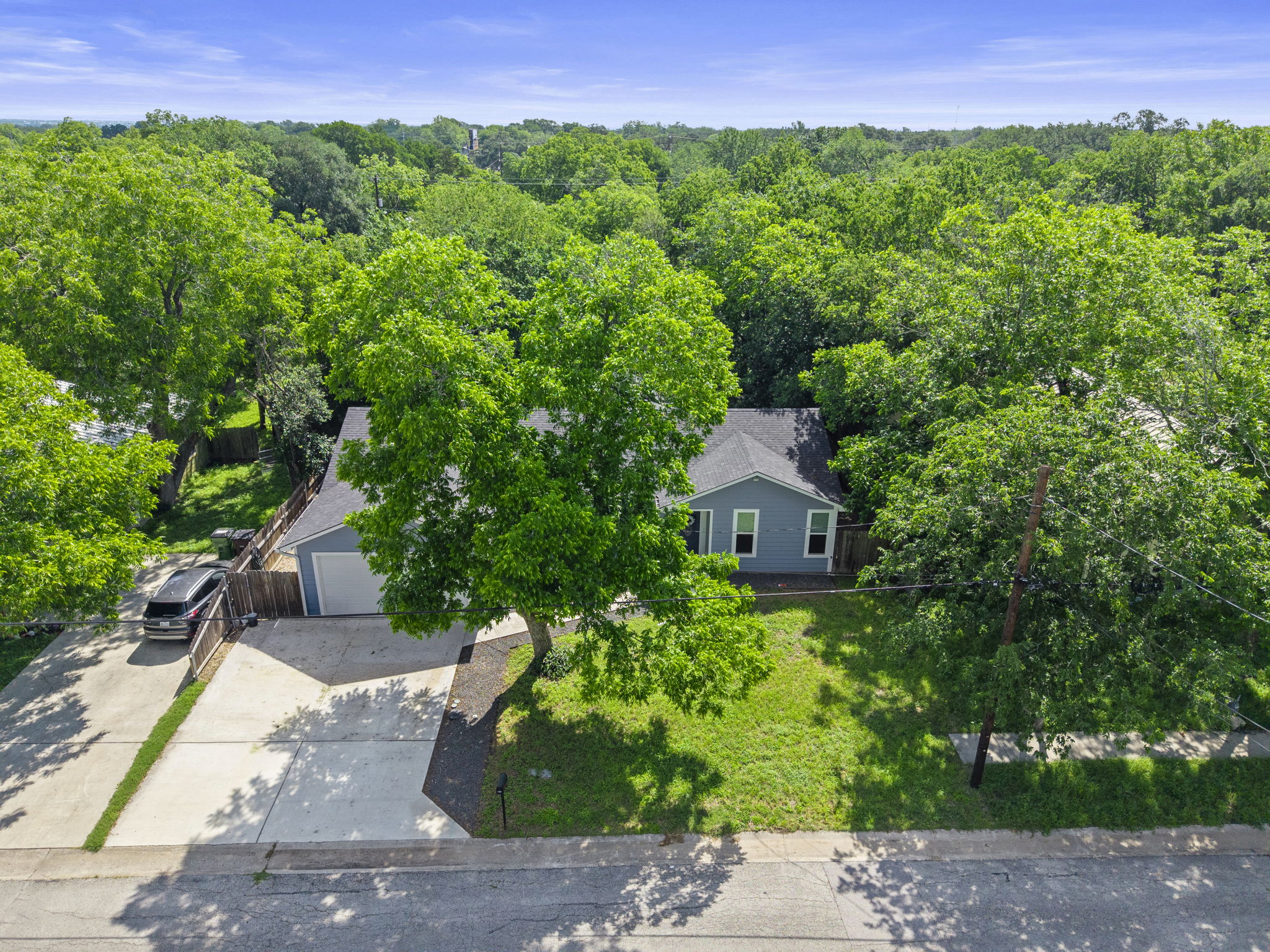 700 South Church Street Lockhart, TX 78644 - Photo 34 of 37 Surrounded by trees and green space.