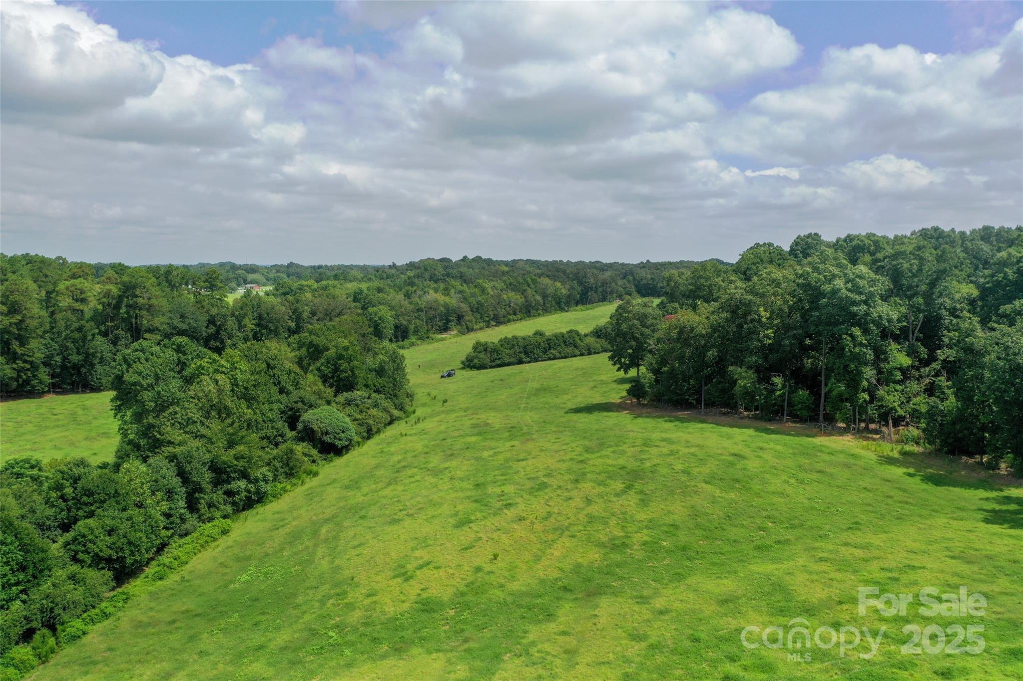 0 Old Goldmine Road, Unit H Marshville, NC 28103 - Photo 21 of 45 a view of a field of grass and trees