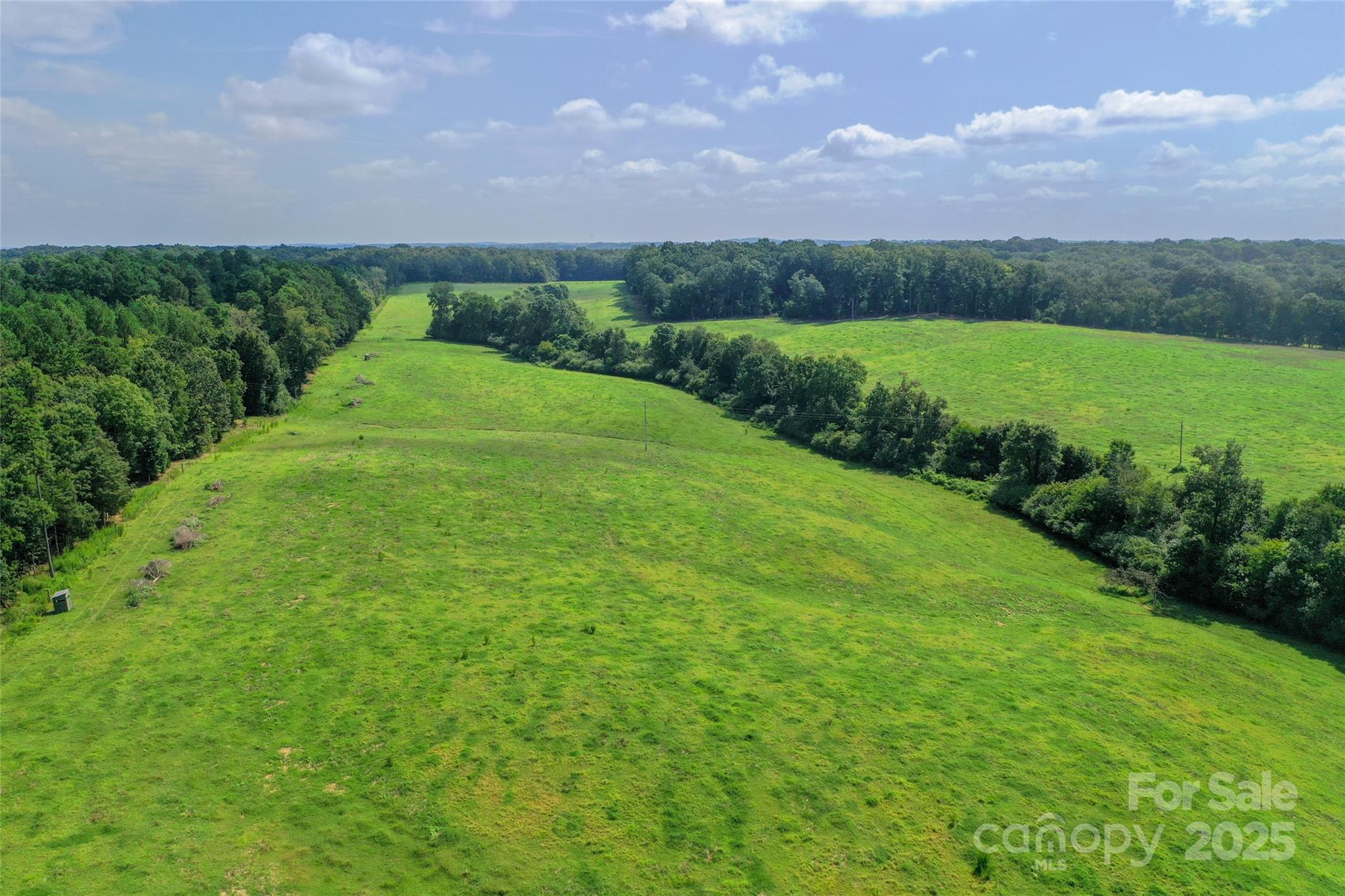 0 Old Goldmine Road, Unit H Marshville, NC 28103 - Photo 8 of 45 a view of a lush green outdoor space with a lake in the background