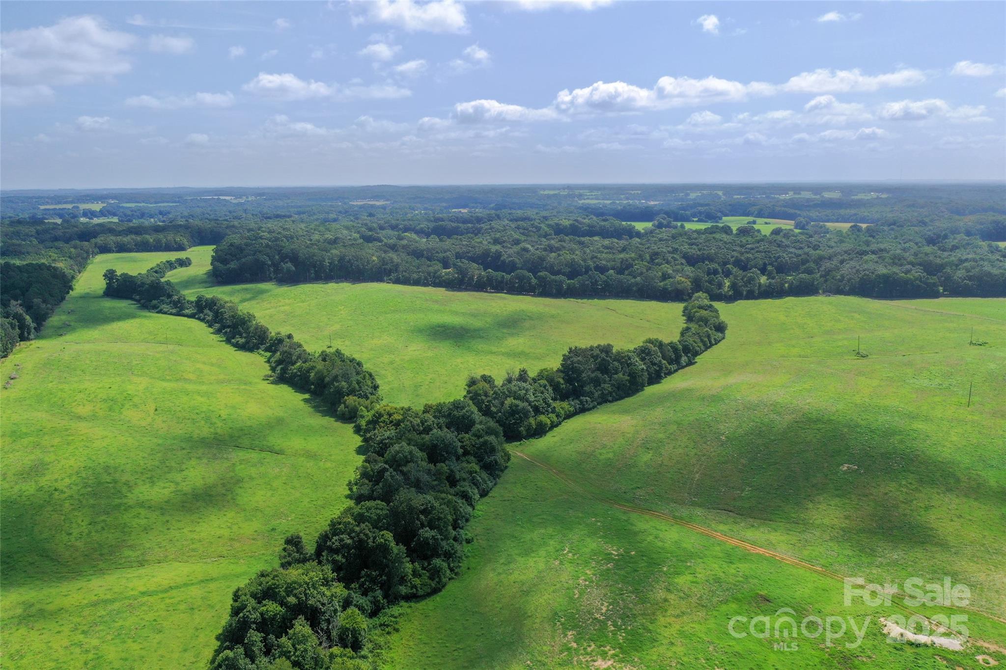 0 Old Goldmine Road, Unit H Marshville, NC 28103 - Photo 9 of 45 a view of a golf course with a lake