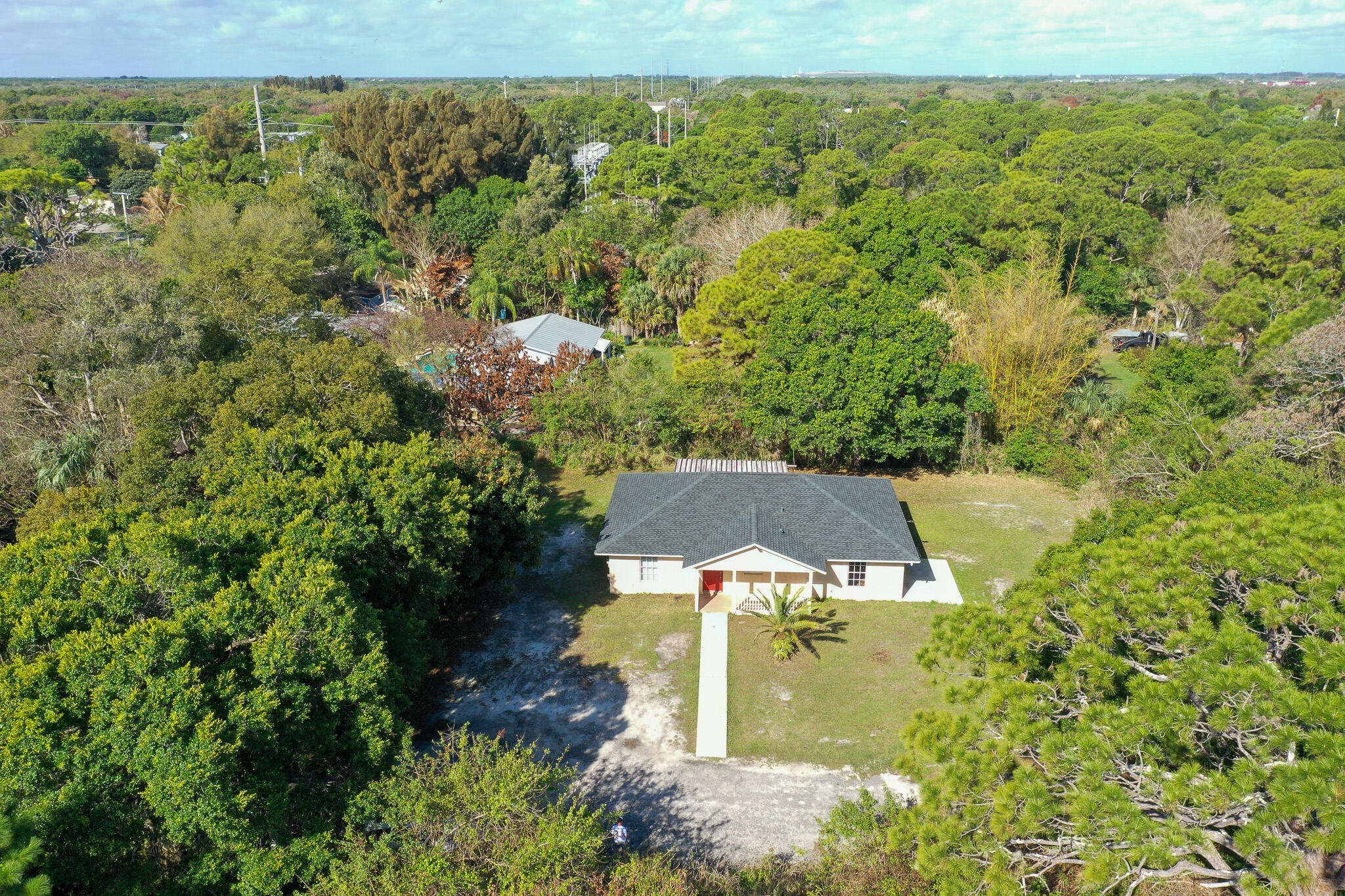 an aerial view of a house with a yard