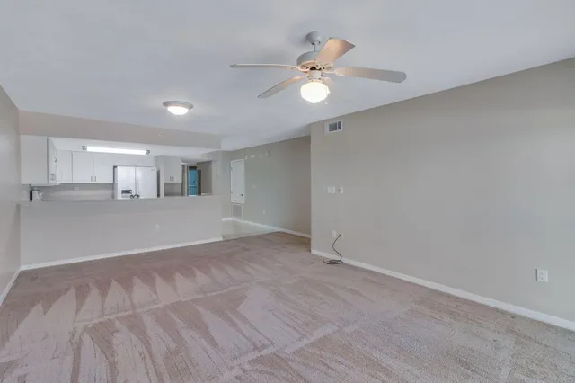 a view of a kitchen with a sink and a window