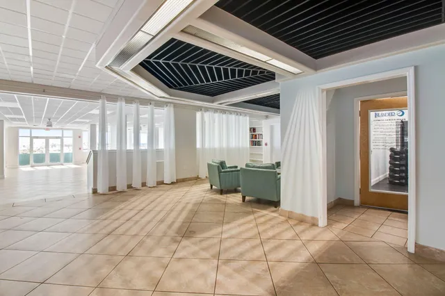 a view of swimming pool with outdoor seating