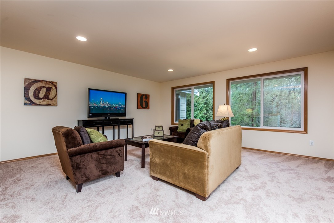 14419 152nd Place Southeast Renton, WA 98059 - Photo 17 of 25 a living room with furniture and a flat screen tv