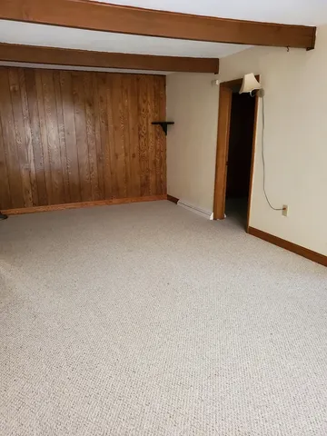 a view of walk in closet with clothes