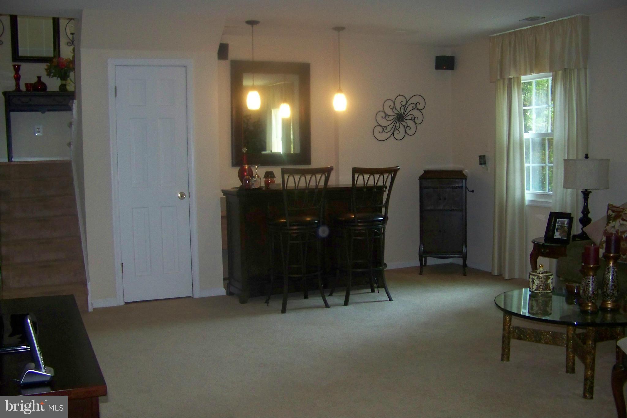 90 Circle Road Pasadena, MD 21122 - Photo 18 of 21 Family Room Bar Rea w/Pendant Lights