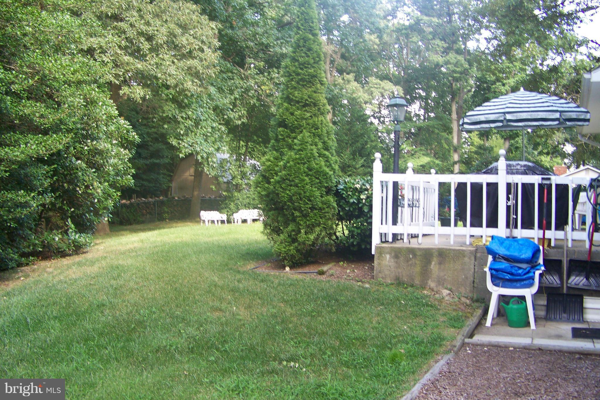 90 Circle Road Pasadena, MD 21122 - Photo 3 of 21 Back Yard & Deck