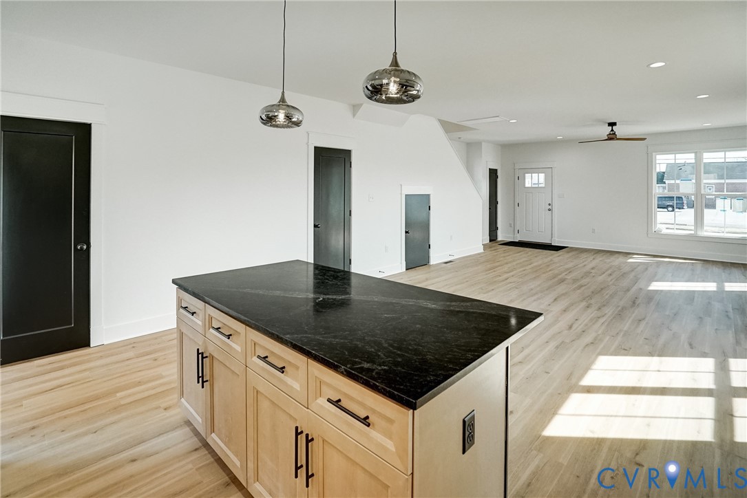 901 Commerce Street Petersburg, VA 23803 - Photo 23 of 40 a kitchen with stainless steel appliances granite countertop a sink a oven and a counter space